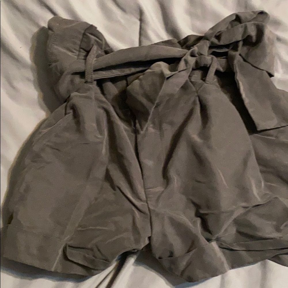 Dark grey shorts.